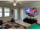 Living area showcases a mounted TV and entertainment center, creating a relaxing space at 13359 Orca Sound Dr, Riverview, FL 33579