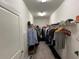 Organized walk-in closet with ample hanging space and shelving at 13359 Orca Sound Dr, Riverview, FL 33579