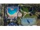 Aerial view of community pool, playground, clubhouse and tennis courts at 13507 Mango Bay Dr, Riverview, FL 33579