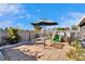 Backyard featuring a patio with umbrella, table and chairs and easy access to an above ground pool at 13507 Mango Bay Dr, Riverview, FL 33579