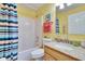 Bright bathroom featuring a shower and tub combo, complemented by a granite countertop at 13507 Mango Bay Dr, Riverview, FL 33579