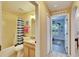 Bright bathroom with a shower-tub combo, vanity, and modern fixtures at 13507 Mango Bay Dr, Riverview, FL 33579