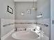 Bright bathroom featuring a corner soaking tub at 13507 Mango Bay Dr, Riverview, FL 33579