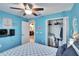 Cozy bedroom with nautical themed decor and a ceiling fan at 13507 Mango Bay Dr, Riverview, FL 33579