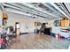 Spacious garage with ample storage and a clean, finished interior with wood-look flooring at 13507 Mango Bay Dr, Riverview, FL 33579