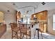Modern kitchen featuring granite countertops, breakfast bar seating, and stainless steel appliances at 13507 Mango Bay Dr, Riverview, FL 33579