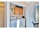 Efficient laundry closet with a stacked washer and dryer, perfect for maximizing space at 13507 Mango Bay Dr, Riverview, FL 33579