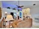 Spacious living room with tile floors, ceiling fan, and view to the entry and bedroom at 13507 Mango Bay Dr, Riverview, FL 33579