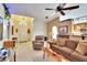 Cozy living room featuring a ceiling fan, plush furniture, and lots of natural light at 13507 Mango Bay Dr, Riverview, FL 33579