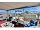 Screened patio featuring comfortable seating, a table with umbrella, and view of the backyard at 13507 Mango Bay Dr, Riverview, FL 33579