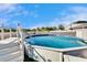 Above ground pool with white fence and deck at 13507 Mango Bay Dr, Riverview, FL 33579