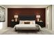 Elegant main bedroom with a padded headboard, bench, and stylish decor at 15083 Zircon Red Dr, Wimauma, FL 33598