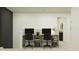 Upstairs office space featuring a black and brown double desk with chairs, perfect for a home office or study area at 15083 Zircon Red Dr, Wimauma, FL 33598