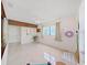 Bonus Room with tile flooring, ceiling fan, and natural light at 16004 2Nd E St, Redington Beach, FL 33708
