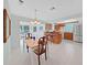 Bright kitchen with tile floors, a breakfast bar, and stainless steel appliances at 16004 2Nd E St, Redington Beach, FL 33708