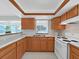 Functional kitchen features countertops, wooden cabinets, and modern appliances at 16004 2Nd E St, Redington Beach, FL 33708
