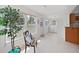 Sunroom featuring bright light, tiled flooring, and views of the backyard at 16004 2Nd E St, Redington Beach, FL 33708