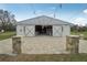 Exterior of barn features an outdoor brick patio and wide entrance at 2040 Underwood Ln, Zephyrhills, FL 33540