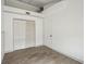 Bedroom features wood-look flooring, white walls, and bi-fold closet at 2040 Underwood Ln, Zephyrhills, FL 33540
