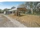 Goat and sheep pens including metal shelters, with metal fencing, and grazing areas at 2040 Underwood Ln, Zephyrhills, FL 33540