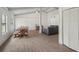 Spacious living and dining area with wood-look floors, vaulted ceiling, and modern furnishings at 2040 Underwood Ln, Zephyrhills, FL 33540