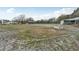 This property features a large open pasture with multiple storage sheds and a small home at 2040 Underwood Ln, Zephyrhills, FL 33540
