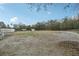 This property features a large open pasture with multiple storage sheds and animal shelters at 2040 Underwood Ln, Zephyrhills, FL 33540
