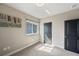 Neutrally decorated bedroom with carpet, a wall art piece, and bright window light at 2575 Claymore St, Odessa, FL 33556