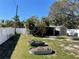 Well-maintained backyard featuring garden beds, a storage shed and privacy fencing at 2656 44Th S St, Gulfport, FL 33711