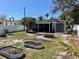 Well-maintained backyard with garden beds, privacy fencing and tropical landscaping at 2656 44Th S St, Gulfport, FL 33711