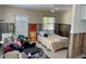Bedroom area featuring terrazzo flooring, large window, and ceiling fan at 2656 44Th S St, Gulfport, FL 33711