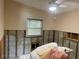 Cozy bedroom with a ceiling fan and ample natural light, ready to be transformed into your personal haven at 2656 44Th S St, Gulfport, FL 33711