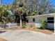 Charming home featuring a well-maintained yard, vibrant landscaping, and a classic white picket fence at 2656 44Th S St, Gulfport, FL 33711