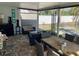 Covered lanai featuring a dining table, outdoor sofas and access to the well-maintained backyard at 2656 44Th S St, Gulfport, FL 33711