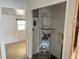 Laundry area with metal shelving, window and water heater at 2656 44Th S St, Gulfport, FL 33711