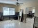 Living room featuring a window offering natural light and a ceiling fan at 2656 44Th S St, Gulfport, FL 33711