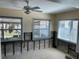 Living room with multiple windows offering ample natural light and ceiling fan at 2656 44Th S St, Gulfport, FL 33711