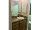 Bathroom featuring a granite countertop vanity, sink, and framed mirror at 2765 Countryside Blvd # 106, Clearwater, FL 33761