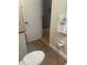 Bathroom with a tiled floor, granite countertops, and a toilet at 2765 Countryside Blvd # 106, Clearwater, FL 33761