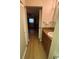 Bathroom with a granite countertop vanity and wood look flooring throughout at 2765 Countryside Blvd # 106, Clearwater, FL 33761