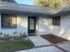 Inviting front entrance with a well-maintained walkway and charming landscaping at 2765 Countryside Blvd # 106, Clearwater, FL 33761