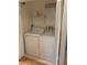 A laundry closet containing a Whirlpool washer and dryer at 2765 Countryside Blvd # 106, Clearwater, FL 33761