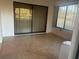 Screened in patio with tiled floors and large sliding glass door at 2765 Countryside Blvd # 106, Clearwater, FL 33761