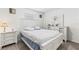 Bright bedroom with a white wooden bed frame, matching dresser, and neutral-toned carpet at 2839 Gumbo Limbo Dr, Wimauma, FL 33598