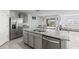 Bright kitchen featuring stainless steel appliances, granite countertops and access to the dining area at 2839 Gumbo Limbo Dr, Wimauma, FL 33598