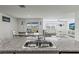 Open kitchen with granite countertops and an island overlooking the dining and living areas at 2839 Gumbo Limbo Dr, Wimauma, FL 33598