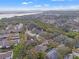Aerial view of a house with a distant view of a bridge over the bay at 3038 Longbrooke Way, Clearwater, FL 33760