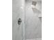 Bathroom walk-in shower with rainfall shower head and modern fixtures surrounded by beautiful tile at 3038 Longbrooke Way, Clearwater, FL 33760