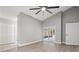 Bedroom with laminate flooring, ceiling fan, closet and sliding glass doors to the screened porch at 3038 Longbrooke Way, Clearwater, FL 33760
