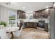 Modern eat-in kitchen with dark cabinets, stainless steel appliances, and ample counter space at 3038 Longbrooke Way, Clearwater, FL 33760